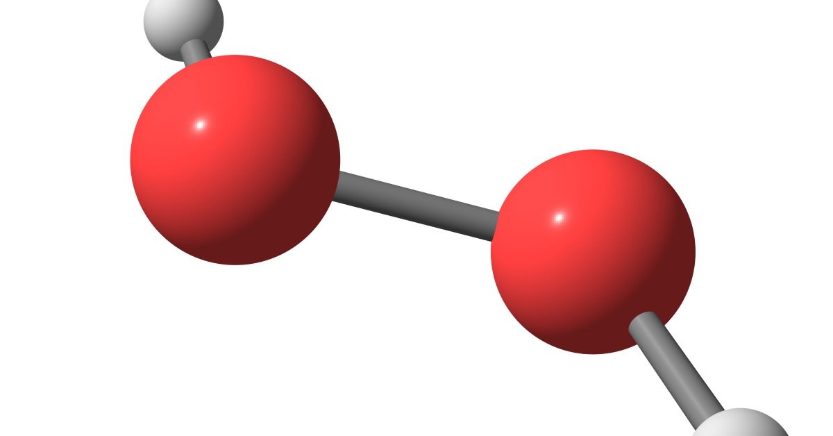 A red and white hydrogen peroxide molecule hanging in the air in front of a white background.